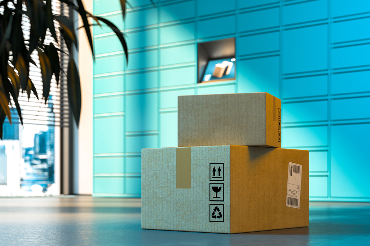 Two parcels in front of a parcel locker in a bright indoor space.