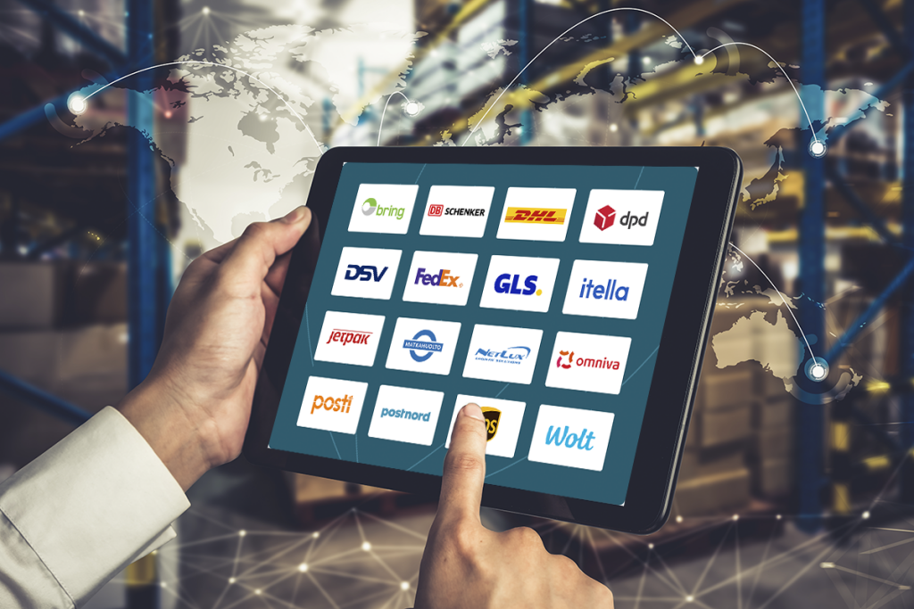 A person using a tablet displaying logos of various logistics companies, including Posti, Matkahuolto, DHL, UPS, and Omniva.